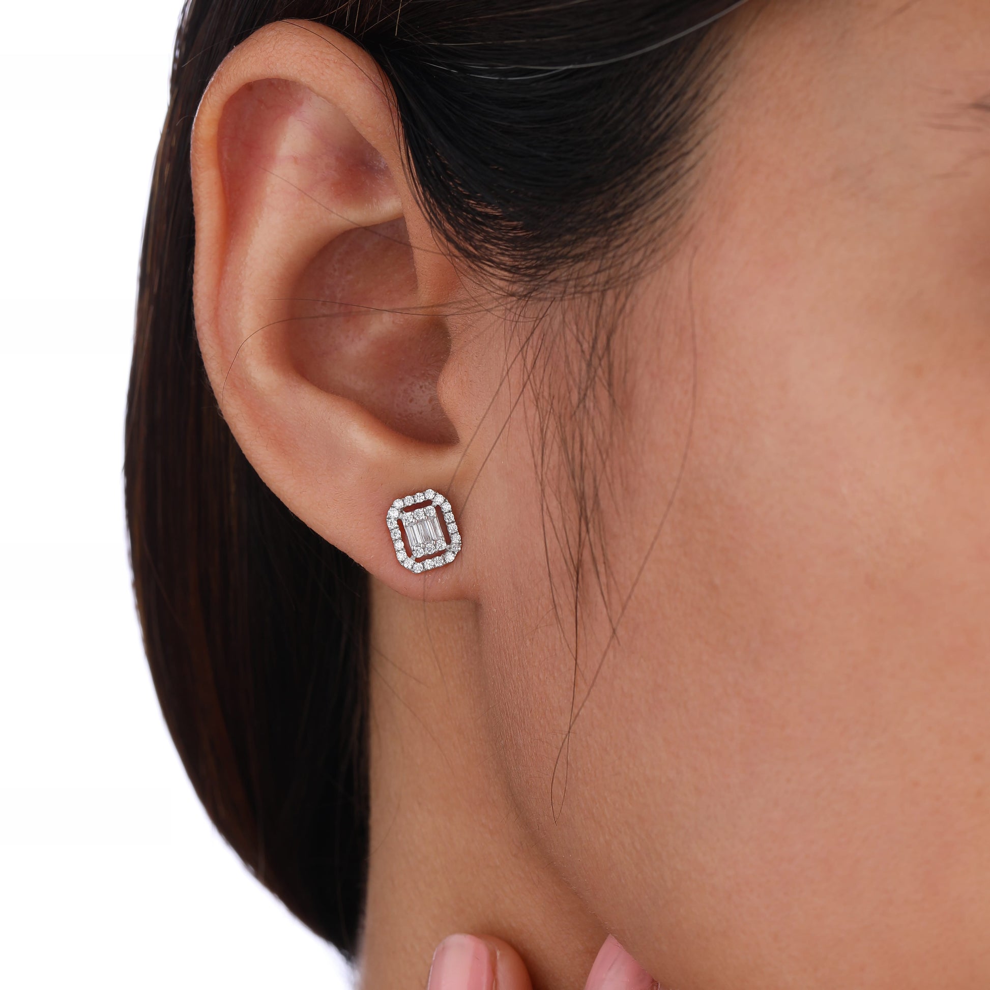 a person wearing stud earring