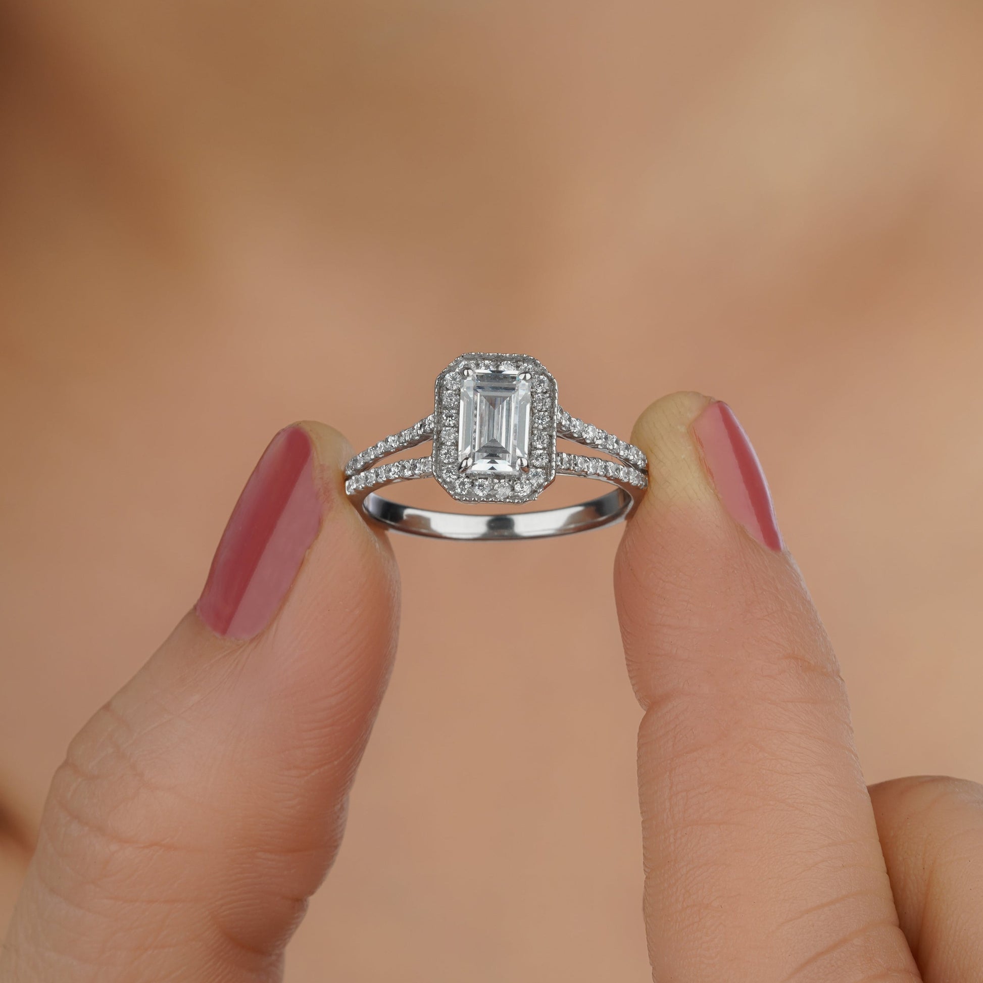 a person holding a diamond ring