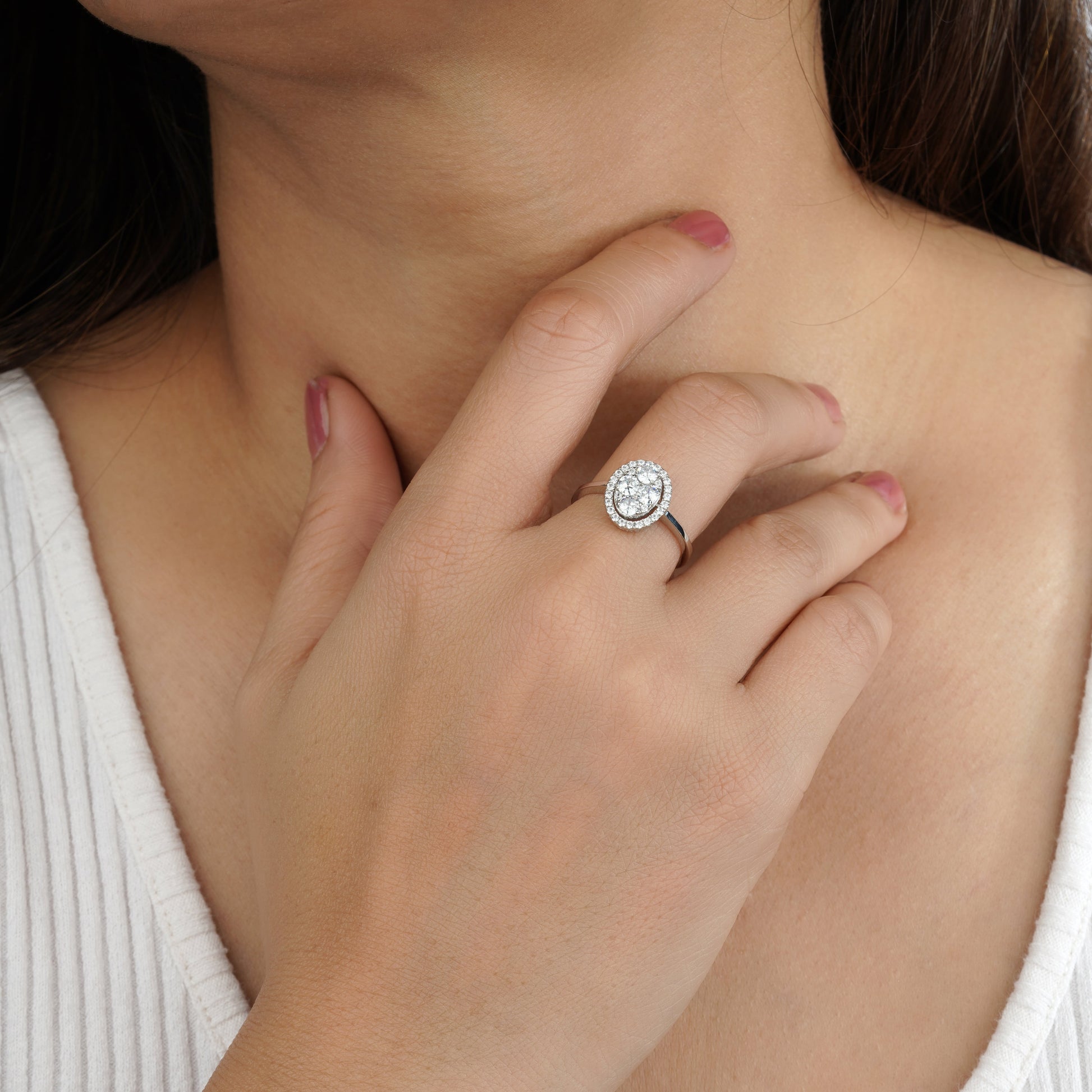 a person holding a diamond ring