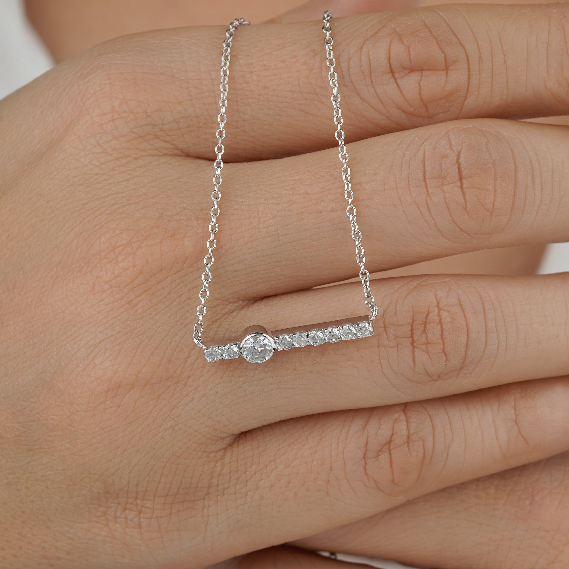 diamond bar necklace on model hand