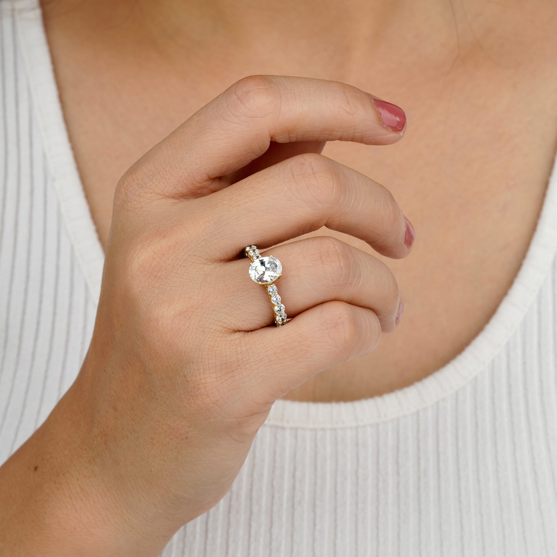 she is wearing Solitaire Engagement Ring