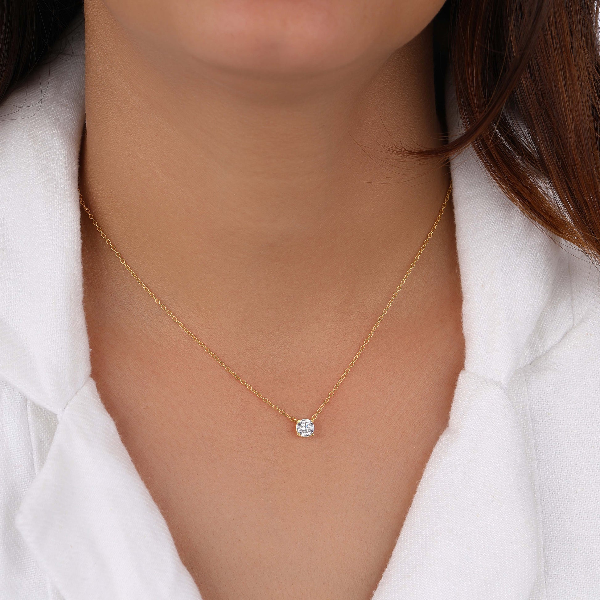 Round Diamond Solitaire Necklace in her neck