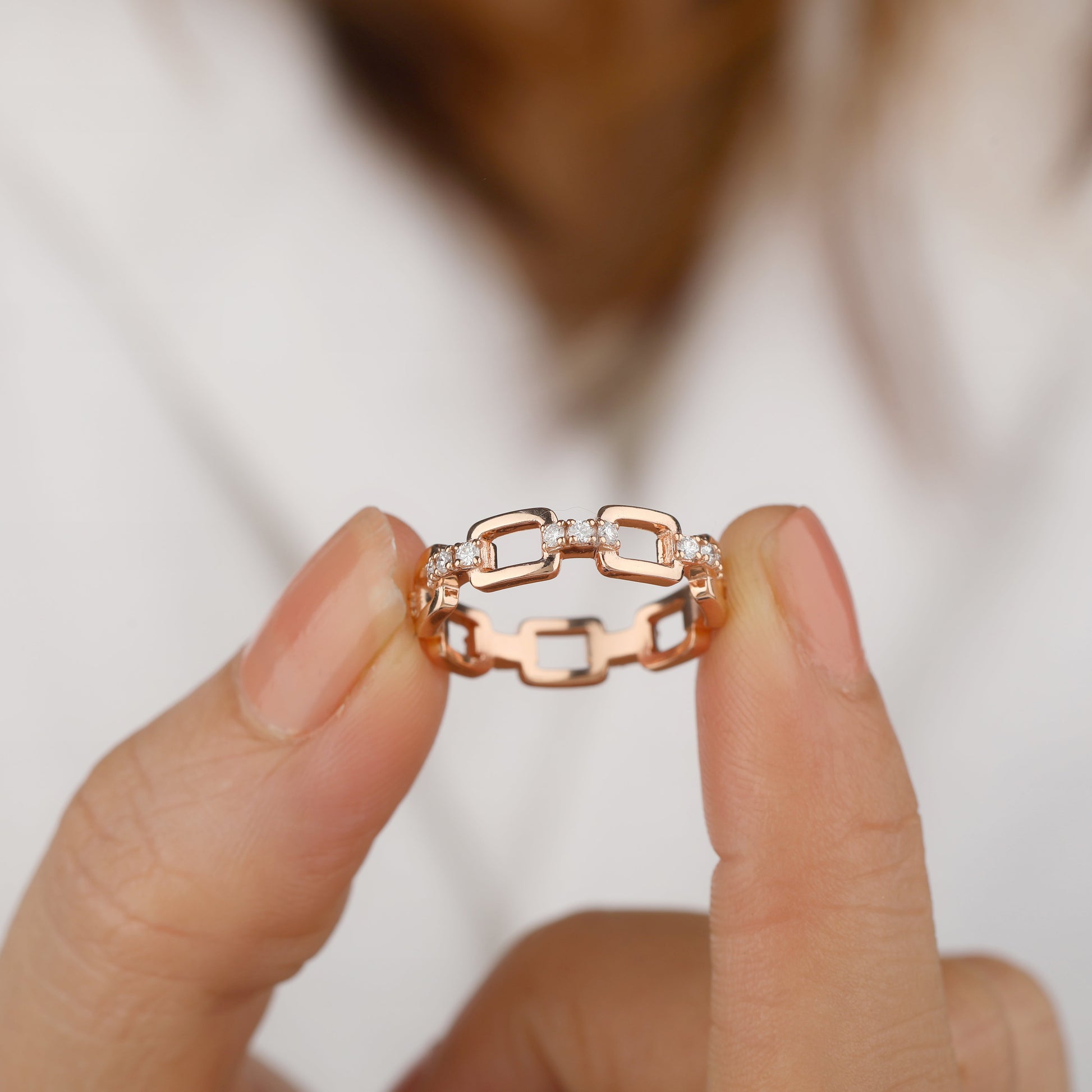 a girl is holding wedding band