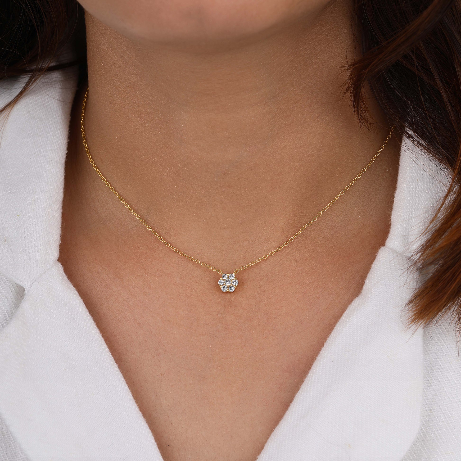 Diamond necklace with gold chain on neck
