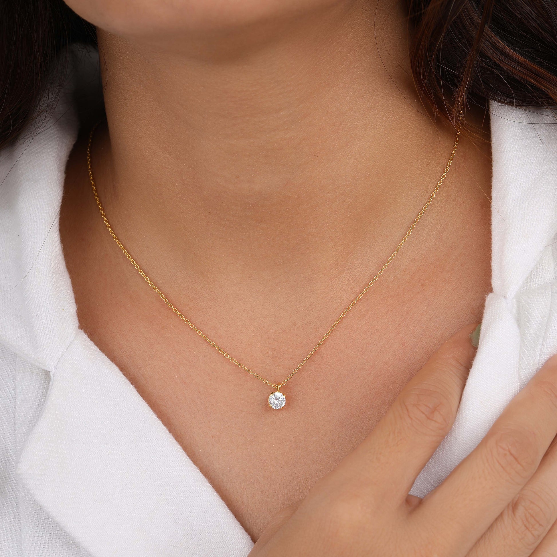A girl wearing round diamond solitaire necklace