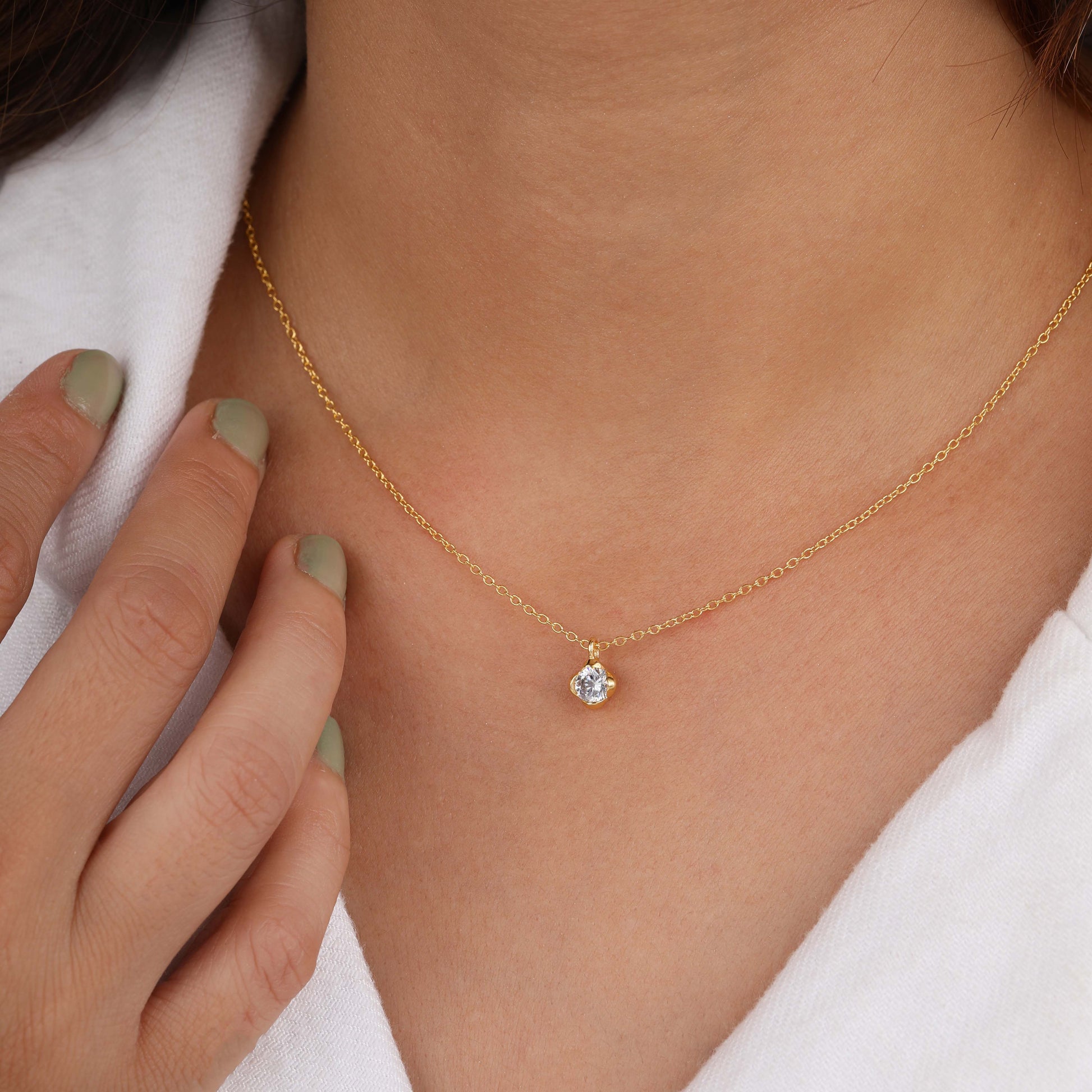 a person wearing solitaire necklace