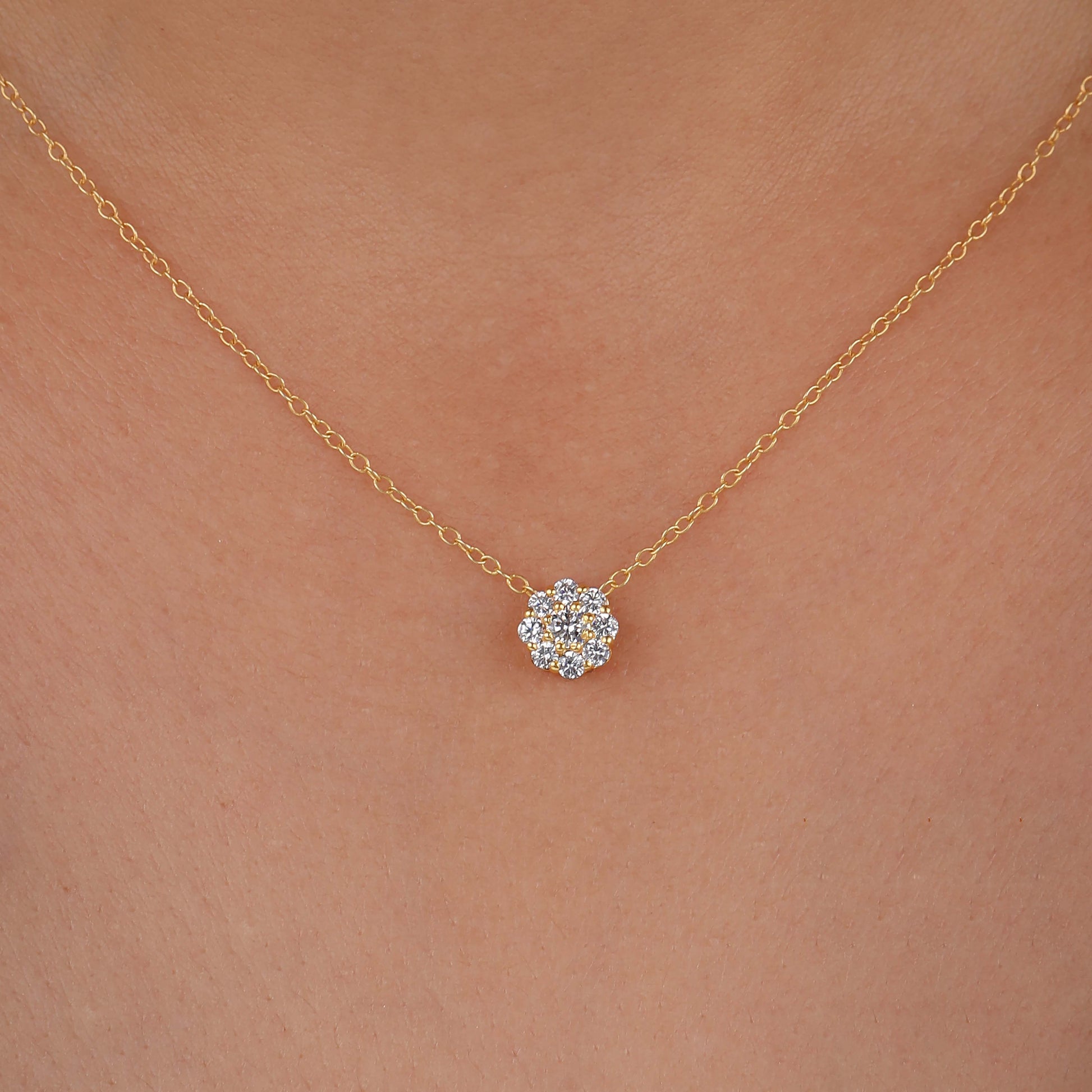 a necklace with a diamond flower