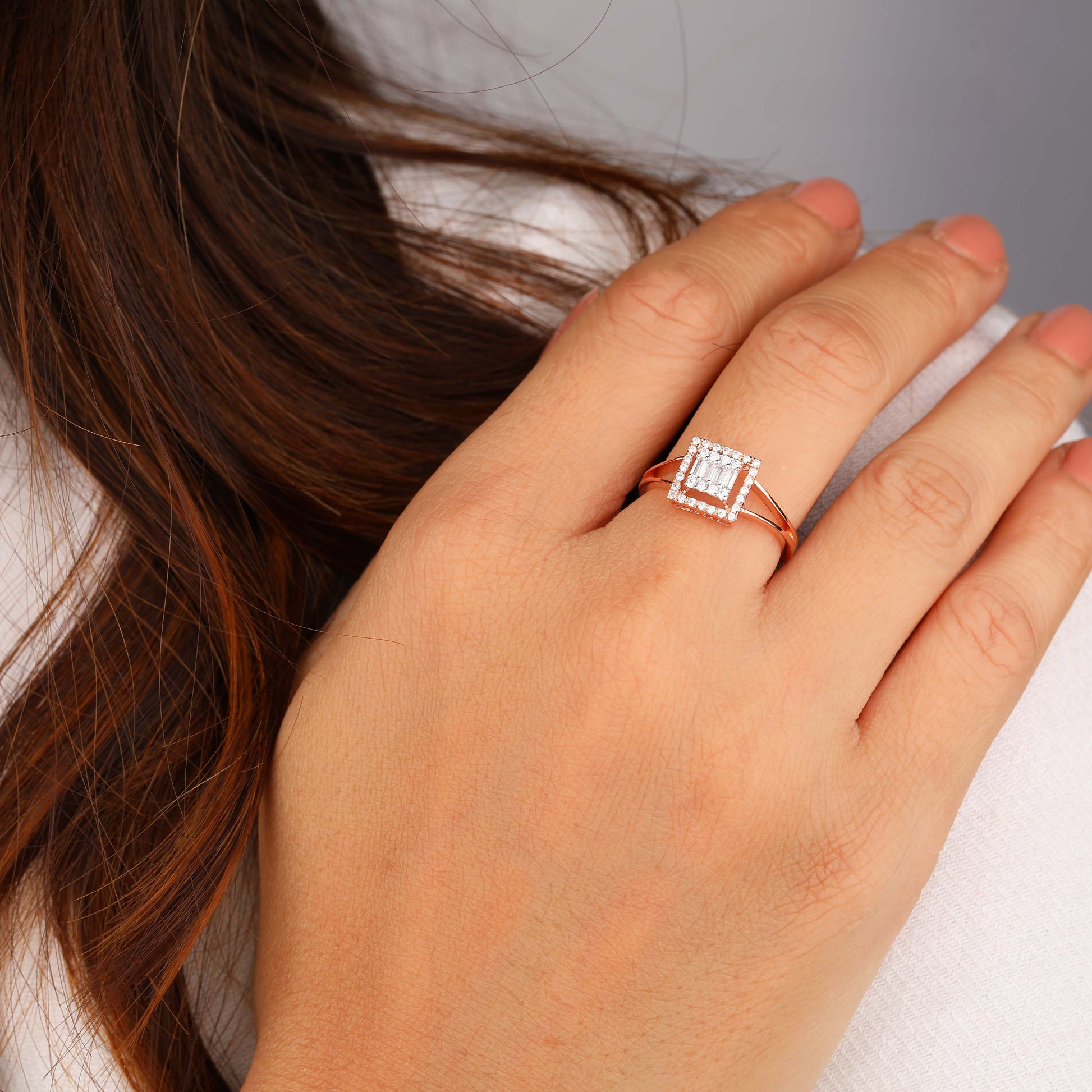 Round & Baguette Halo Ring wearing by person