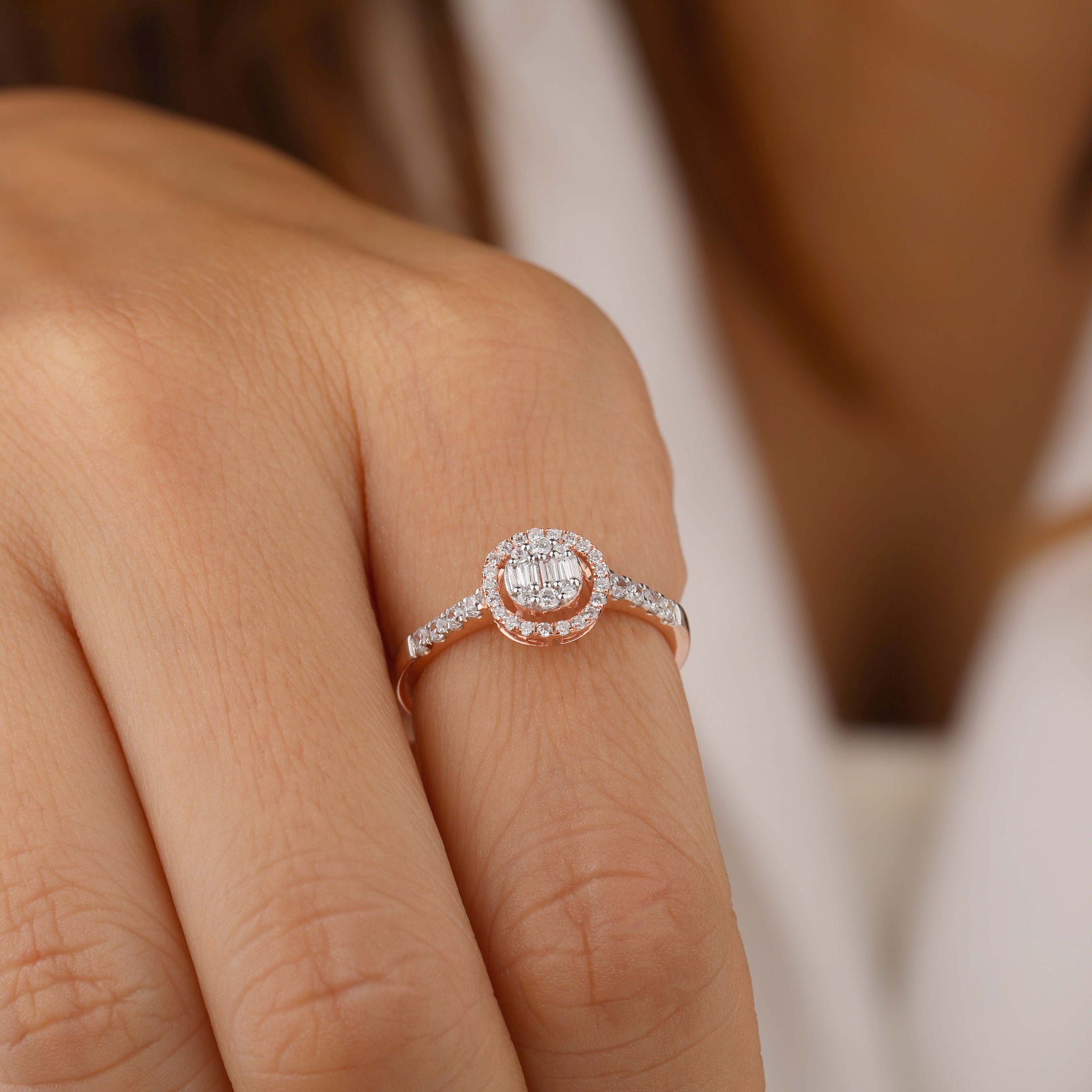 A person Wearing Round halo engagement ring