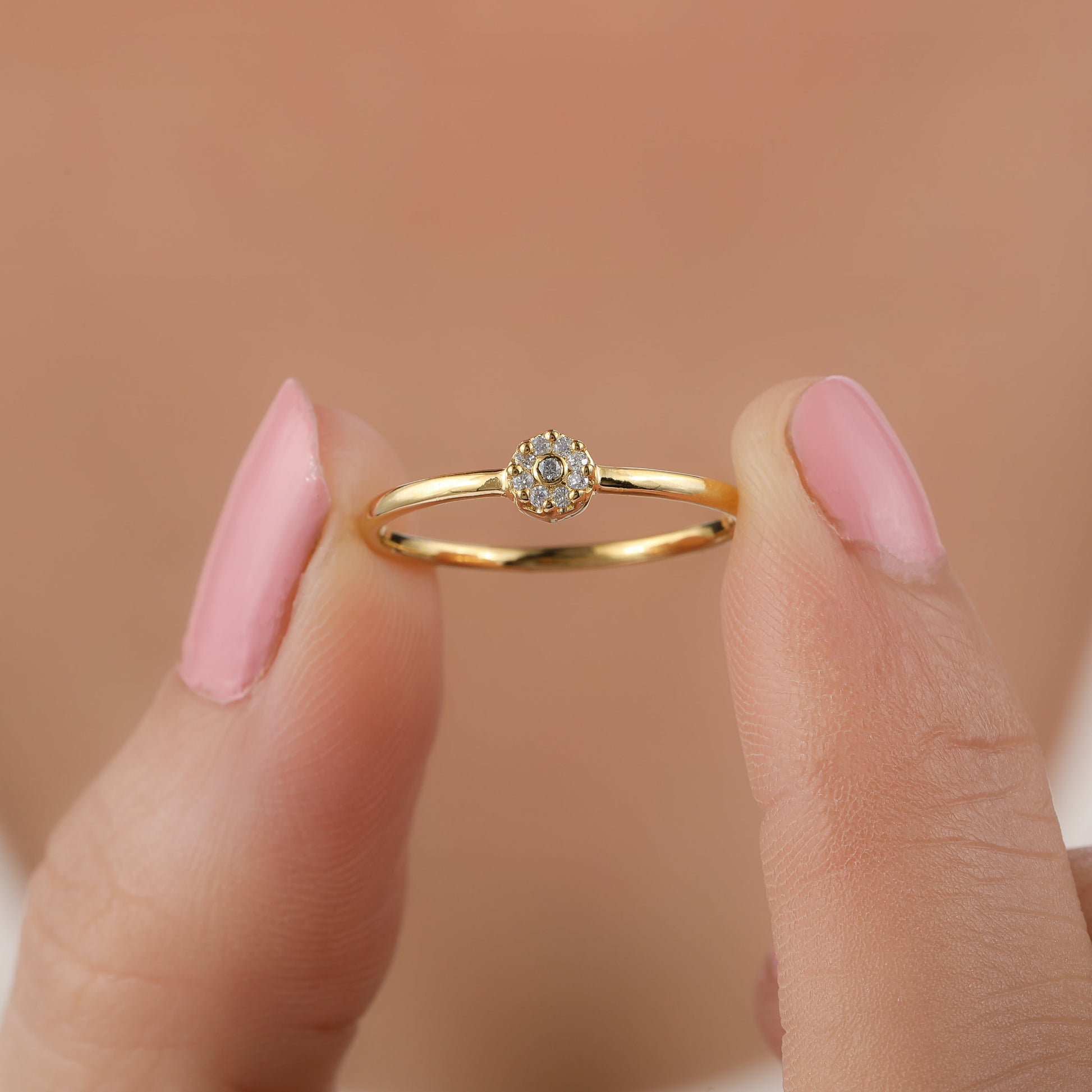 she is holding petite cluster diamond ring