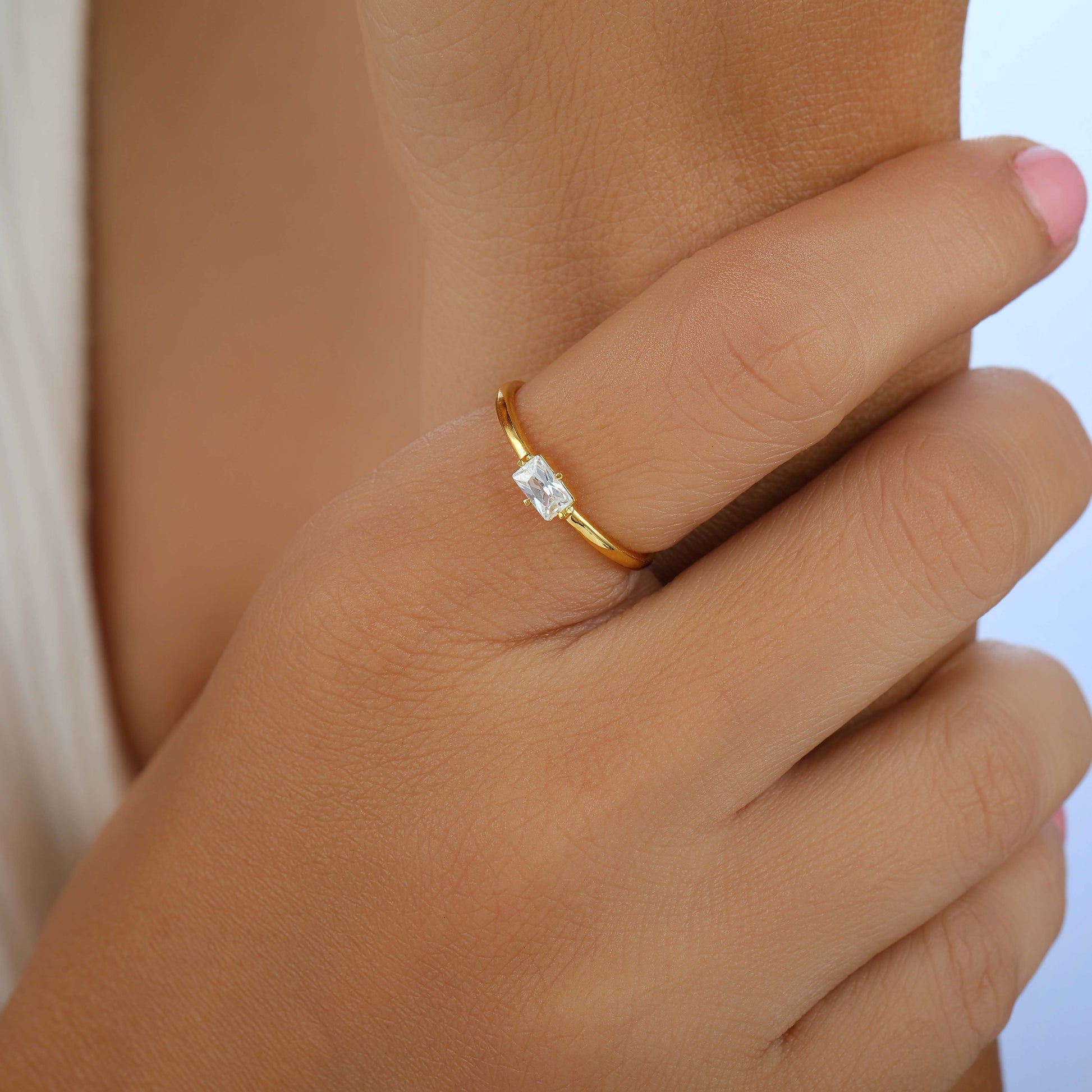 she is wearing Lab-grown Diamond Radiant Cut Engagement Ring