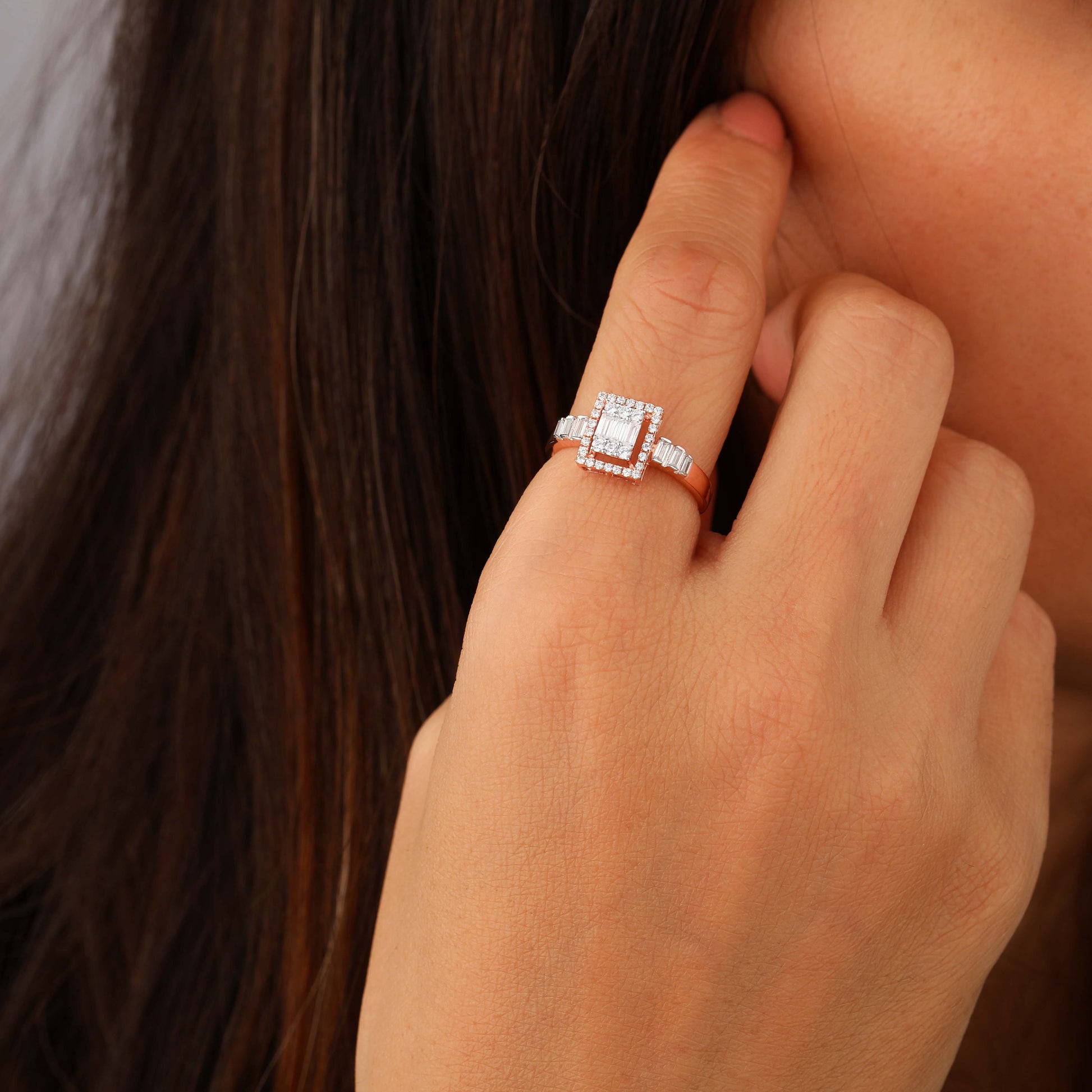 a person wearing square halo ring