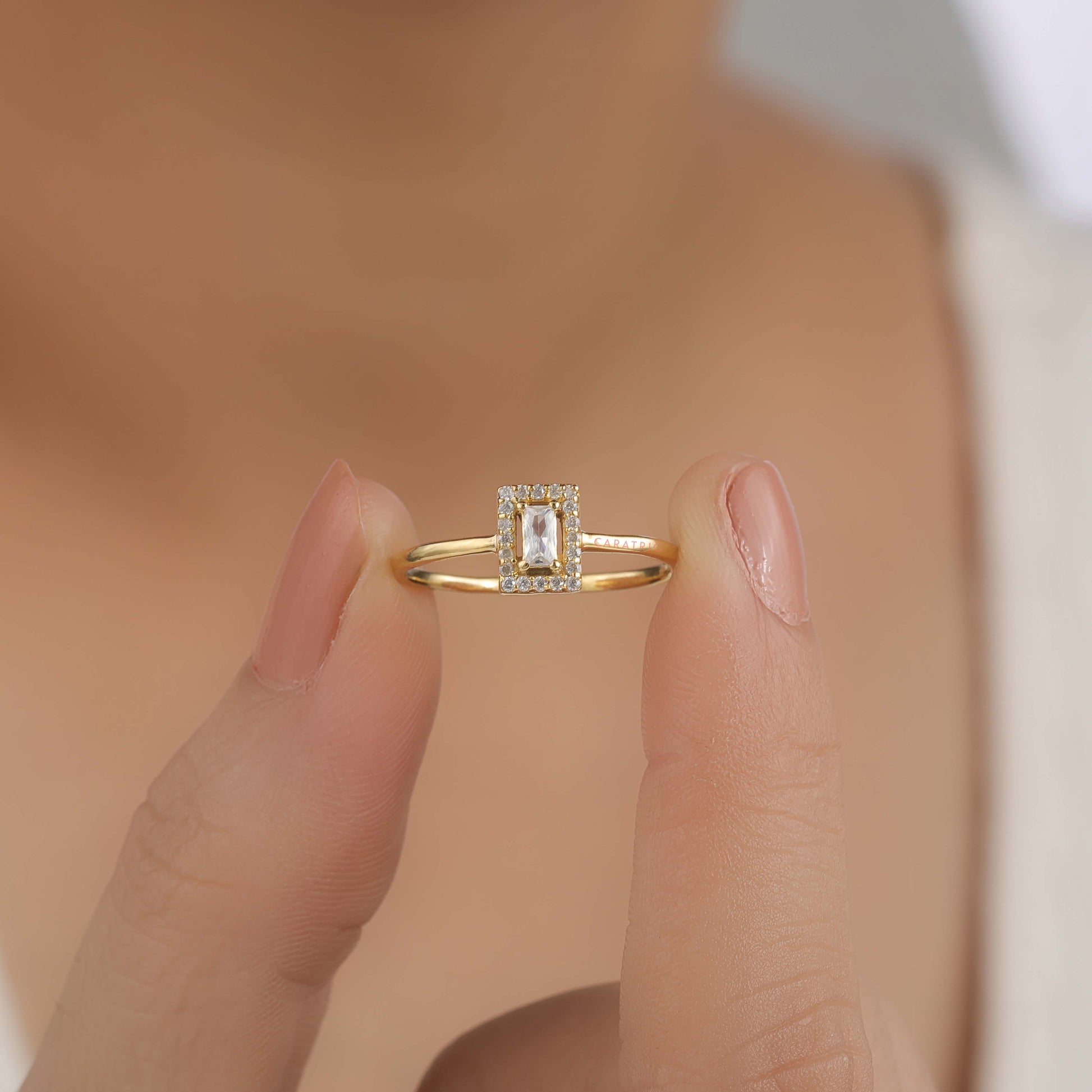 a person holding engagement ring