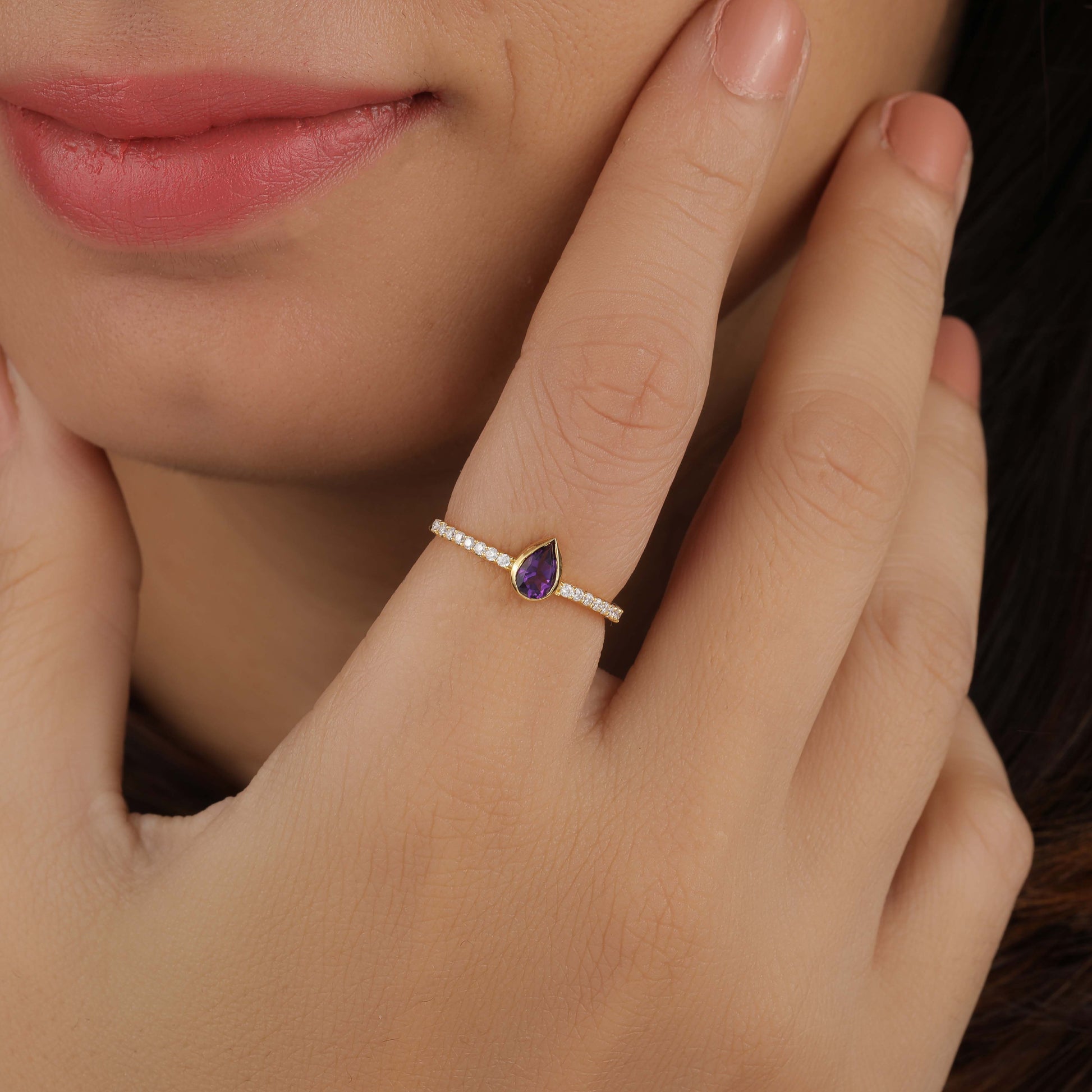 a women has Pear Shaped Amethyst Gemstone Ring
