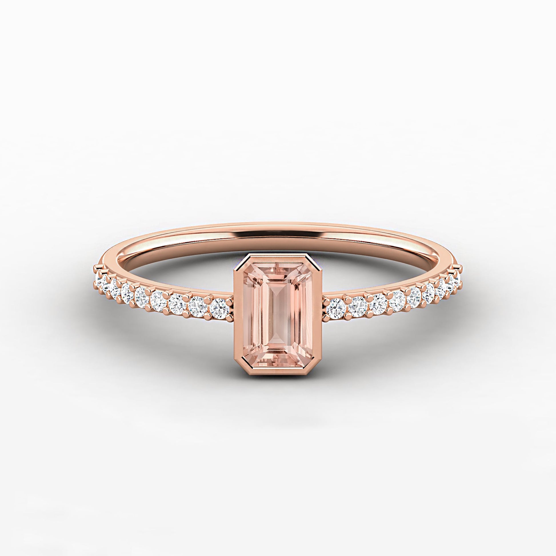 a pink diamond ring with a white background